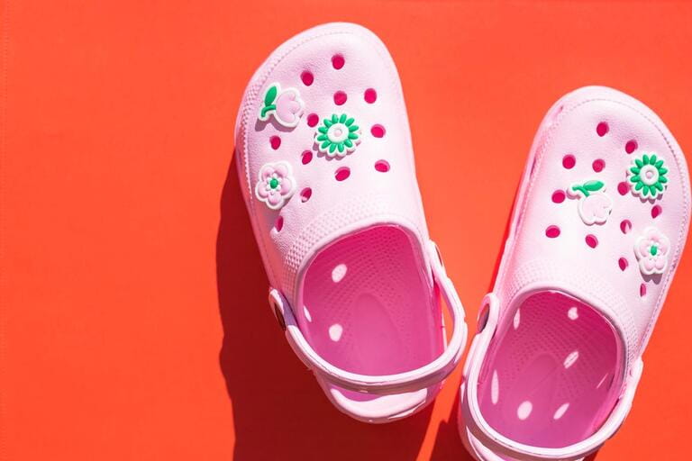 Pink Sandals isolated on bright background.Rubber shoes on a white background. Footwear for the pool. Rubber sneakers for the pool.Copy space.Baby flip flops.Children shoes. Concept of summer. Pink Sandals isolated on bright background.Rubber shoes on a white background. Footwear for the pool. Rubber sneakers for the pool.Copy space.Baby flip flops.Children shoes. Concept of summer.