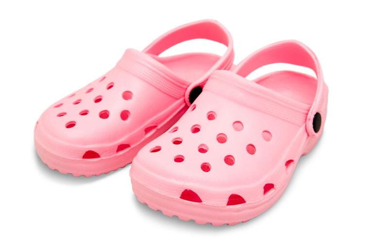 pink childrens rubber sandals isolated on white with clipping path