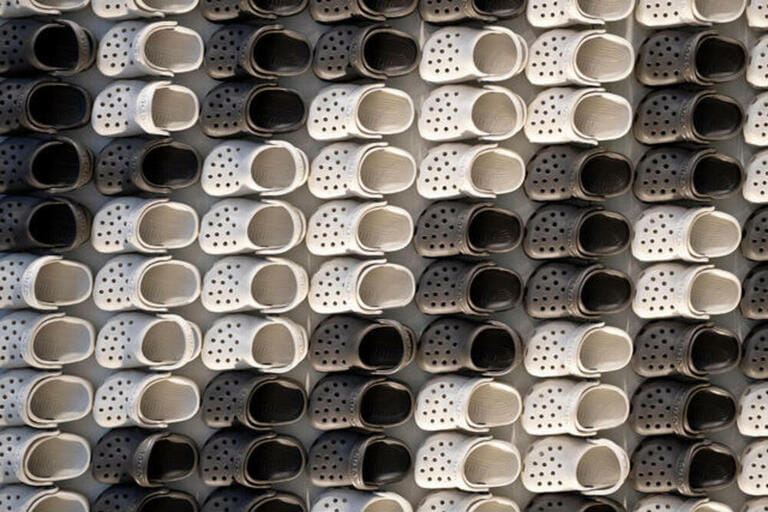 An abstract display of miniature Crocs at the entrance to the Croc Store on West 34th Street in Manhattan, New York City.