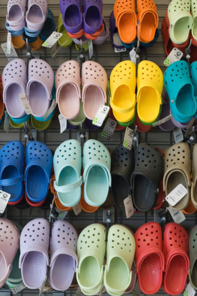 Crocs Shoes hanging on a display rack