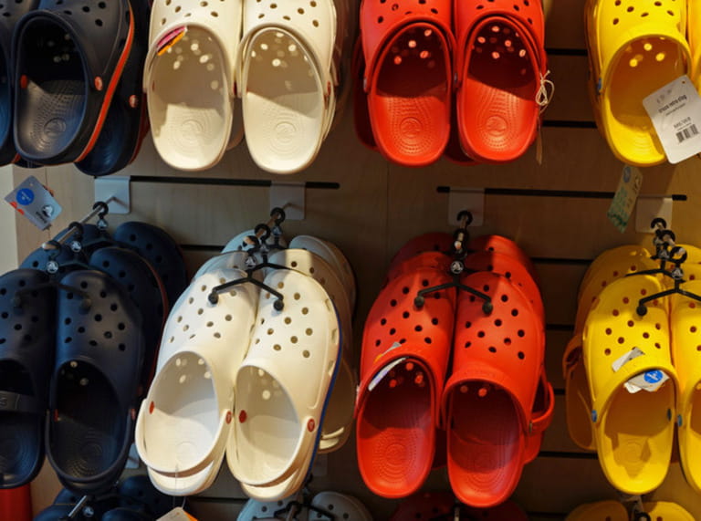 a selection of Crocs shoes in a Crocs shop a selection of Crocs shoes in a Crocs shop