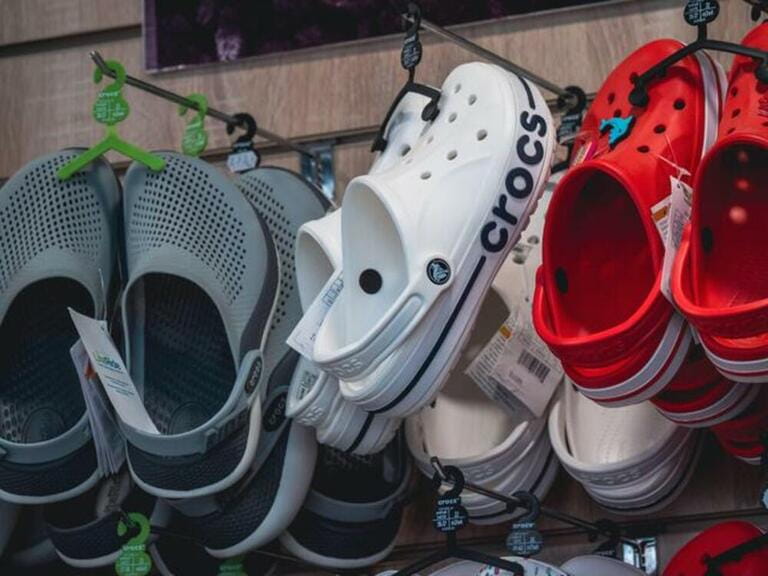 Crocs clogs in shop for sale. Comfortable footwear. Crocs Inc. is American company based in Niwot, Colorado that distributes and manufactures footwear.
